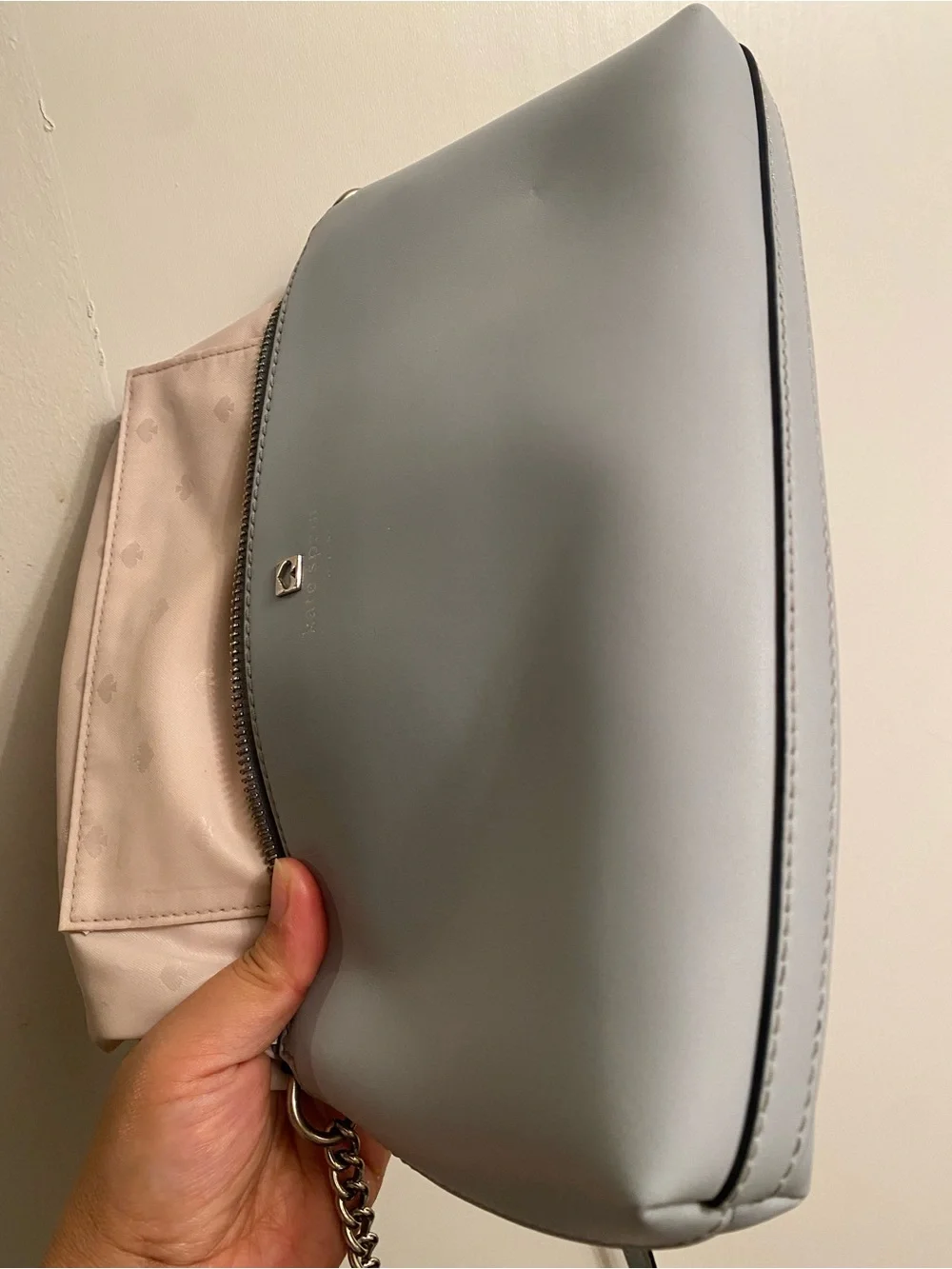 Kate Spade light gray leather crossbody bag with gold spade logo